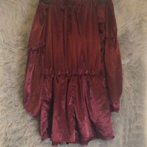 A maroon off the shoulder romper